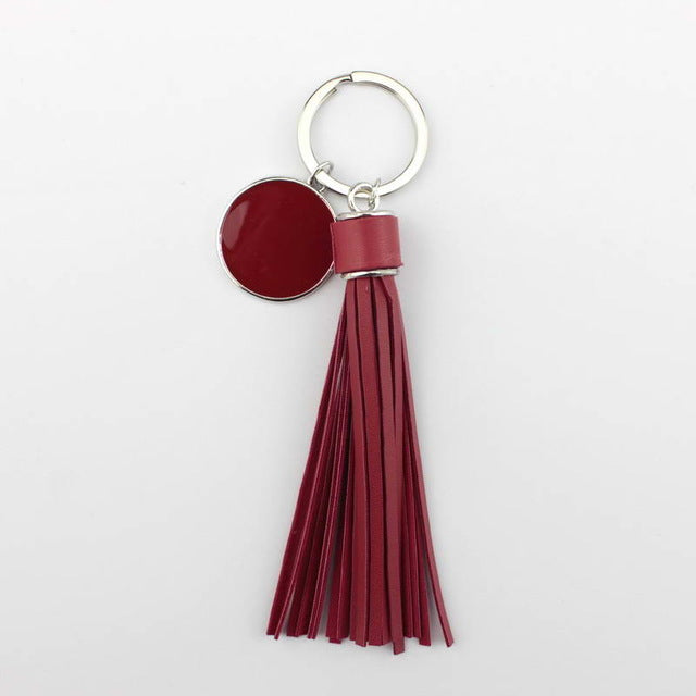 Porte-clés Argenté Avec Pompon En Cuir Mauve - Les Indispensables - Neuf Avec étiquettes
